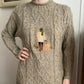 Cable knit mockneck embroidered sweater
